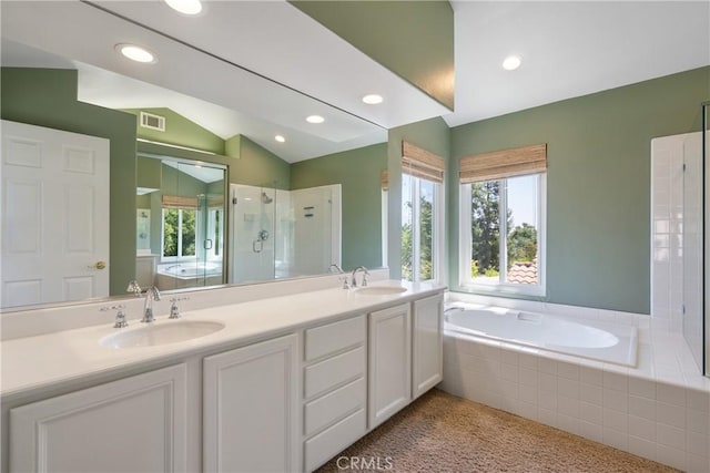 9320 Isaac Lord Dr, Rancho Cucamonga, CA 91701 - bathroom featuring plenty of natural light, a stall shower, a garden tub, double vanity, and recessed lighting