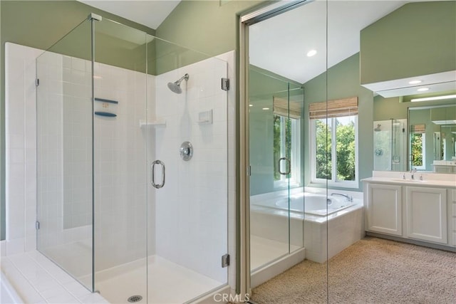 9320 Isaac Lord Dr, Rancho Cucamonga, CA 91701 - full bathroom with vaulted ceiling, vanity, a shower stall, a garden tub, and recessed lighting