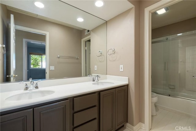 9320 Isaac Lord Dr, Rancho Cucamonga, CA 91701 - bathroom with double vanity, combined bath / shower with glass door, and recessed lighting