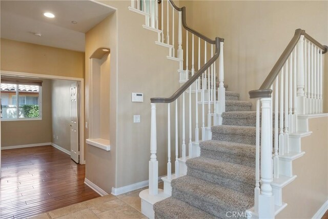 9320 Isaac Lord Dr, Rancho Cucamonga, CA 91701 - staircase featuring baseboards and wood finished floors