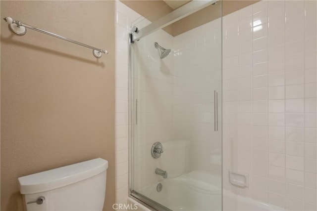 9320 Isaac Lord Dr, Rancho Cucamonga, CA 91701 - bathroom featuring shower / bath combination with glass door and a textured wall