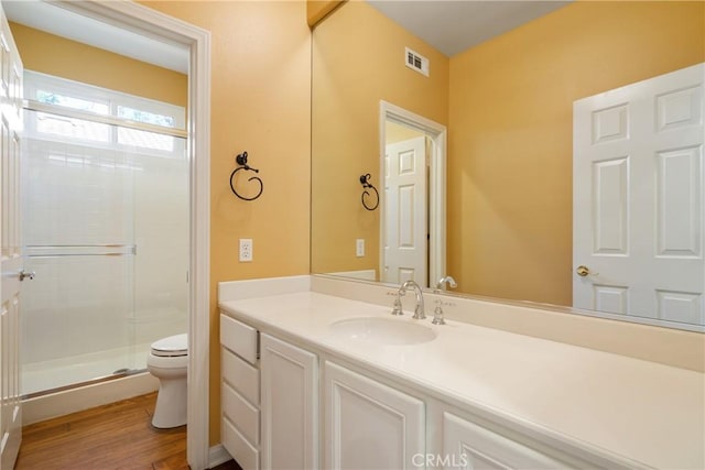 9320 Isaac Lord Dr, Rancho Cucamonga, CA 91701 - full bath with a shower stall, vanity, and wood finished floors
