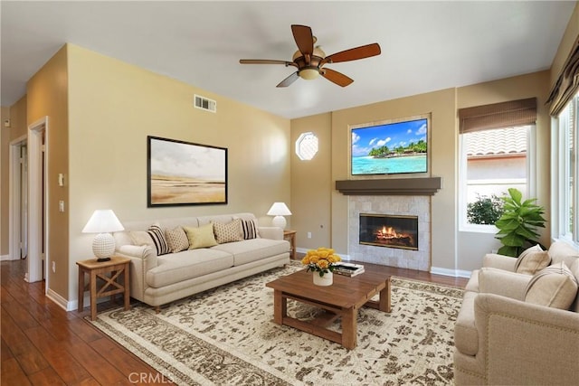 9320 Isaac Lord Dr, Rancho Cucamonga, CA 91701 - living area with hardwood / wood-style floors, a ceiling fan, and a tile fireplace