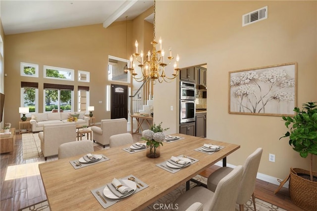 9320 Isaac Lord Dr, Rancho Cucamonga, CA 91701 - dining space with high vaulted ceiling, wood finished floors, a chandelier, and beam ceiling