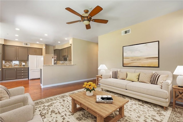 9320 Isaac Lord Dr, Rancho Cucamonga, CA 91701 - living room with light wood-type flooring, ceiling fan, and recessed lighting