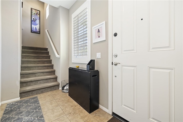 384 Ruby Red Ln, Upland, CA 91786 - tiled entryway featuring baseboards and stairs