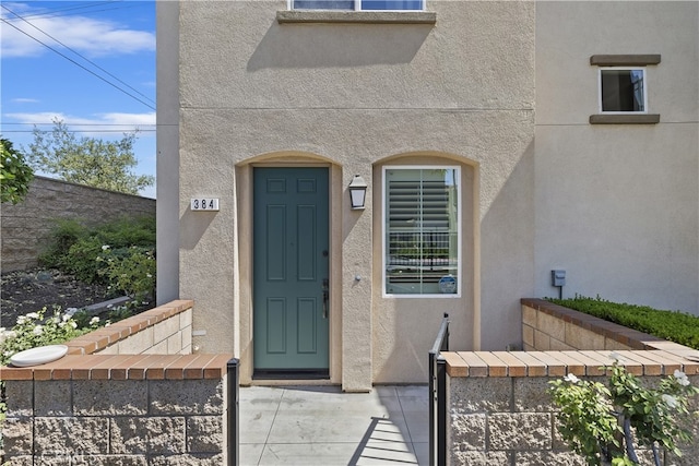 384 Ruby Red Ln, Upland, CA 91786 - doorway to property with stucco siding