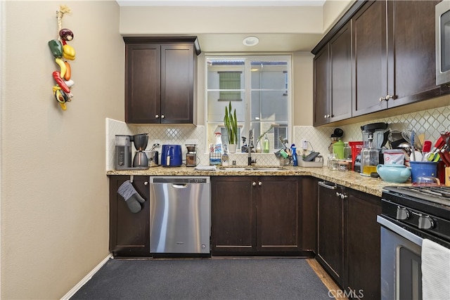 384 Ruby Red Ln, Upland, CA 91786 - kitchen featuring appliances with stainless steel finishes, tasteful backsplash, dark brown cabinets, and light stone countertops