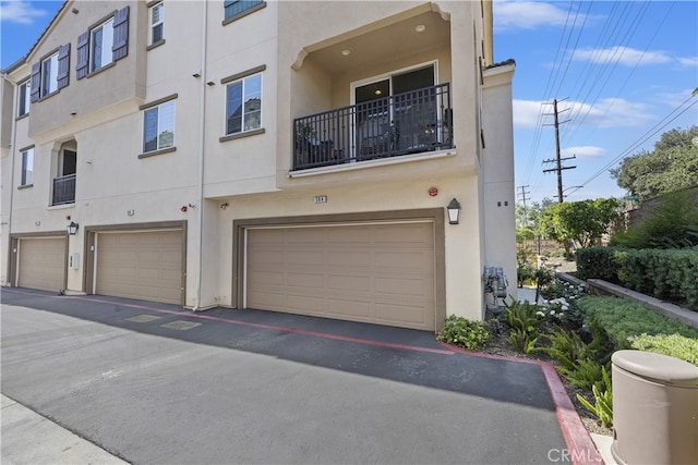 384 Ruby Red Ln, Upland, CA 91786 - view of front of home with stucco siding and an attached garage