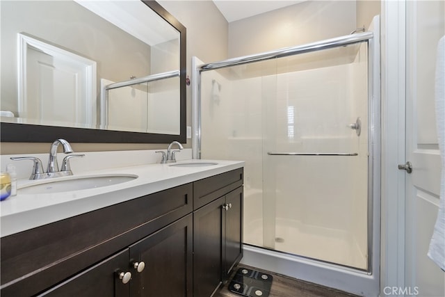 384 Ruby Red Ln, Upland, CA 91786 - full bath featuring a shower stall, double vanity, and wood finished floors