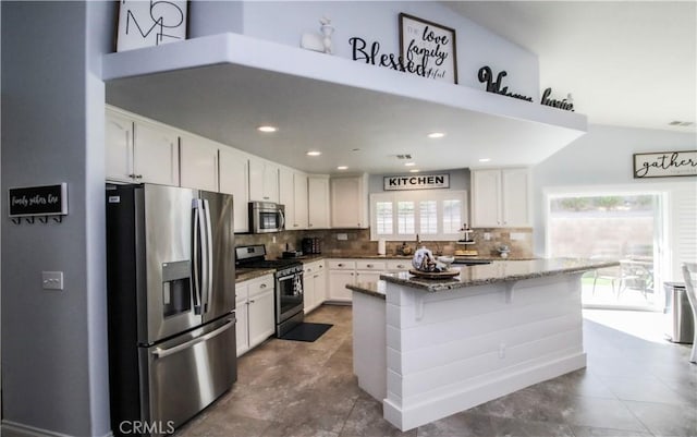 18224 Kalin Ranch Dr, Victorville, CA 92395 - kitchen featuring stainless steel appliances, tasteful backsplash, dark stone countertops, white cabinets, and recessed lighting