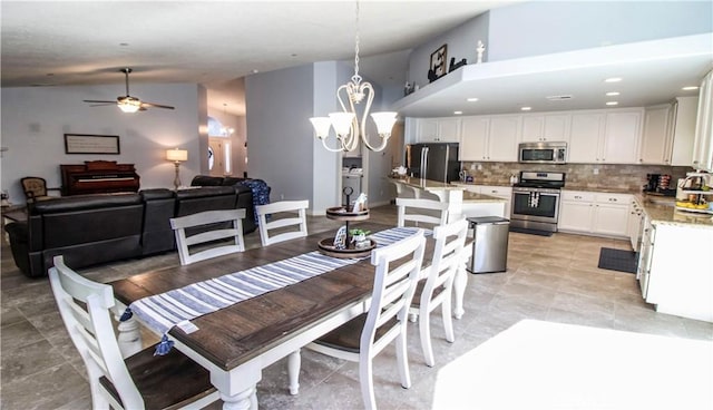 18224 Kalin Ranch Dr, Victorville, CA 92395 - dining room featuring lofted ceiling, ceiling fan, and a chandelier
