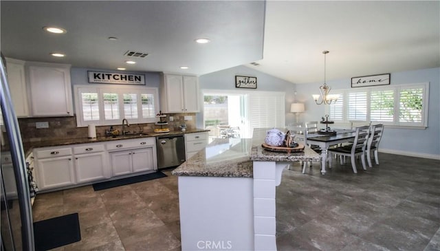 18224 Kalin Ranch Dr, Victorville, CA 92395 - kitchen with dishwasher, healthy amount of natural light, white cabinets, a chandelier, and lofted ceiling