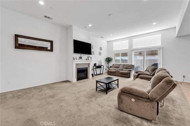 16252 Gibson St, Victorville, CA 92394 - living room with recessed lighting, light colored carpet, and a tiled fireplace
