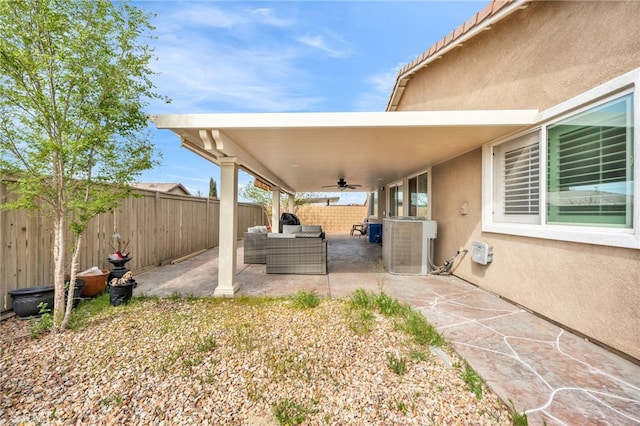 16252 Gibson St, Victorville, CA 92394 - fenced backyard featuring ceiling fan, an outdoor living space, and a patio area