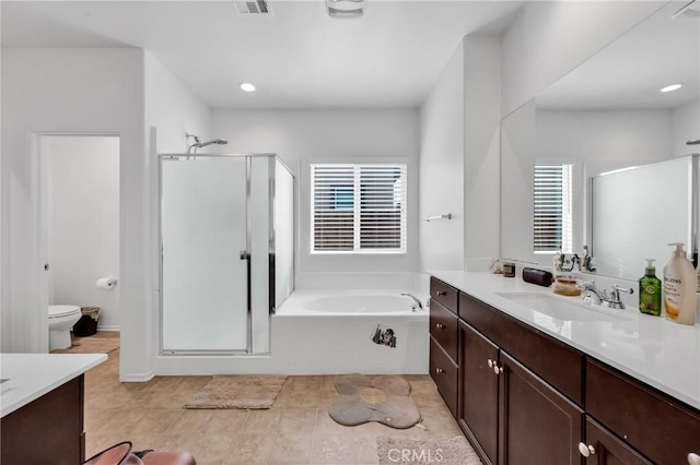 16252 Gibson St, Victorville, CA 92394 - bathroom with vanity, healthy amount of natural light, a stall shower, a bath, and recessed lighting