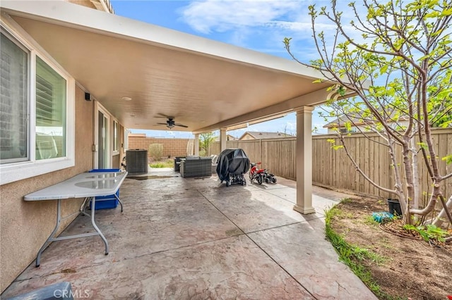 16252 Gibson St, Victorville, CA 92394 - fenced backyard featuring a ceiling fan, a patio, a grill, and an outdoor living space