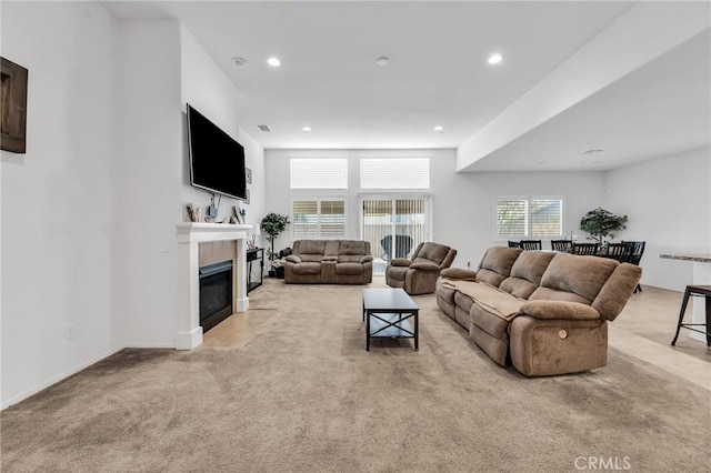 16252 Gibson St, Victorville, CA 92394 - living room with light colored carpet, a tile fireplace, and recessed lighting