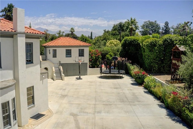1205 W Highland, Redlands, CA 92373 - view of patio with a trampoline and a mountain view