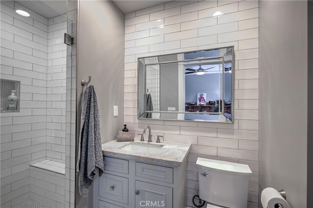 1205 W Highland, Redlands, CA 92373 - bathroom featuring a ceiling fan, vanity, and tiled shower