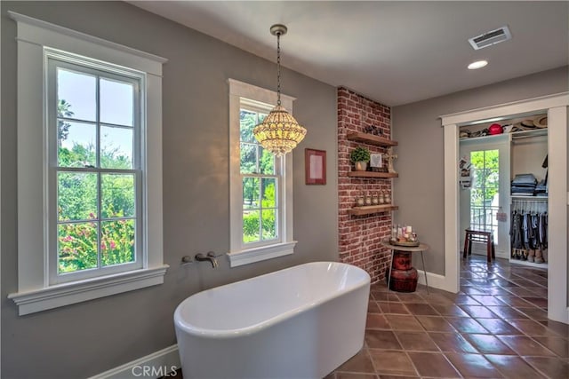 1205 W Highland, Redlands, CA 92373 - bathroom featuring a soaking tub, a chandelier, tile patterned floors, and recessed lighting