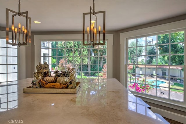 1205 W Highland, Redlands, CA 92373 - dining area featuring a chandelier and healthy amount of natural light