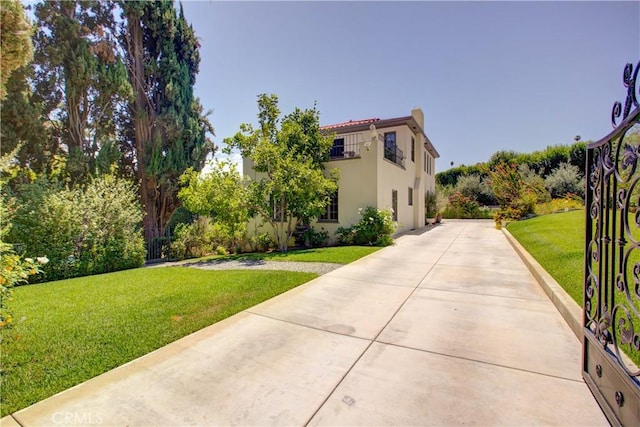 1205 W Highland, Redlands, CA 92373 - view of front facade with a front lawn, driveway, and stucco siding