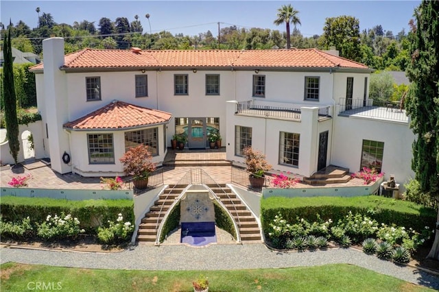 1205 W Highland, Redlands, CA 92373 - back of house with stairs, a chimney, stucco siding, and a tile roof