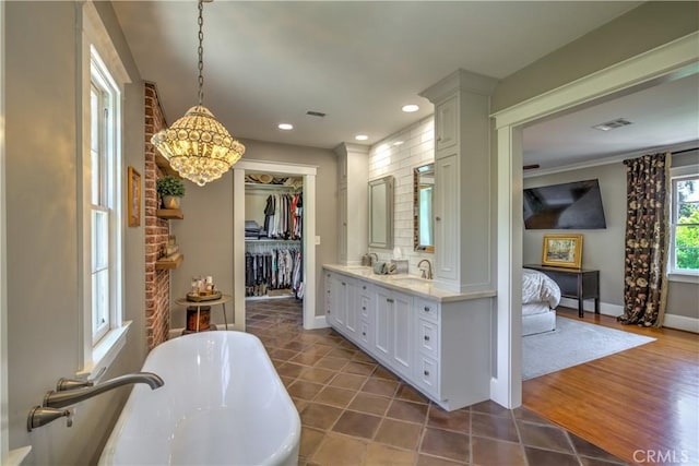 1205 W Highland, Redlands, CA 92373 - full bathroom with a soaking tub, double vanity, a chandelier, recessed lighting, and ensuite bathroom