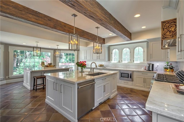 1205 W Highland, Redlands, CA 92373 - kitchen featuring appliances with stainless steel finishes, a chandelier, a kitchen island with sink, healthy amount of natural light, and recessed lighting