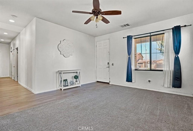 629 Ivy Crest Dr, San Jacinto, CA 92582 - foyer with ceiling fan, wood finished floors, recessed lighting, and carpet floors