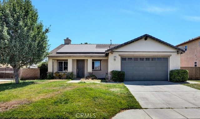 629 Ivy Crest Dr, San Jacinto, CA 92582 - ranch-style house with roof mounted solar panels, an attached garage, driveway, a chimney, and stucco siding