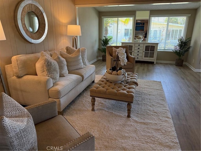 1540 Northwood Rd Unit 11-270L, Seal Beach, CA 90740 - living area with wood finished floors and wood walls