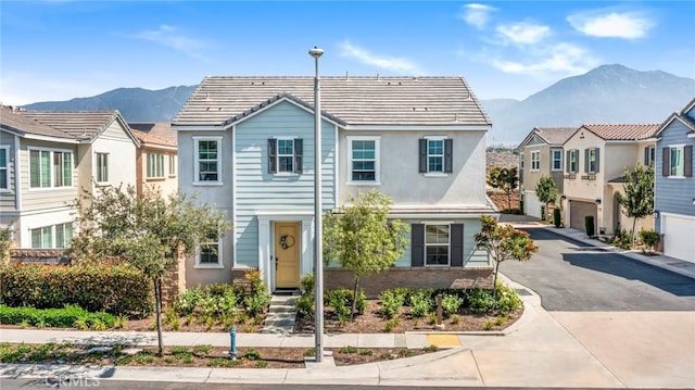 1633 Topeka Pl, Upland, CA 91784 - multi unit property with a mountain view, a garage, driveway, a tiled roof, and stucco siding
