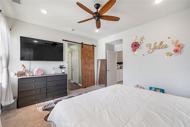 1633 Topeka Pl, Upland, CA 91784 - carpeted bedroom featuring a barn door, recessed lighting, and ceiling fan