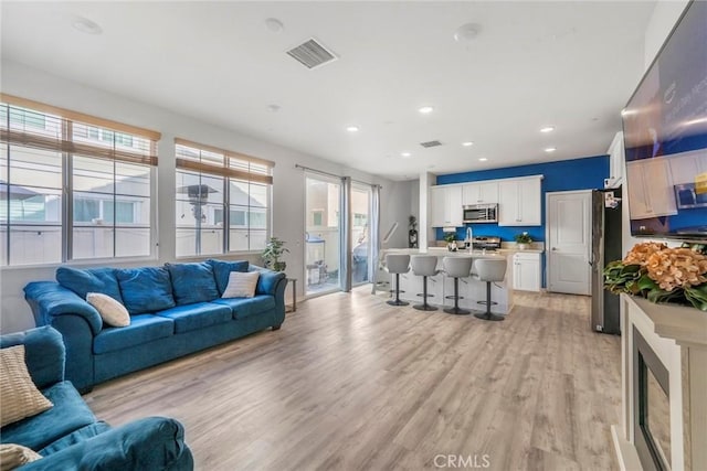 1633 Topeka Pl, Upland, CA 91784 - living area with light wood finished floors and recessed lighting