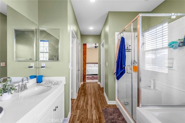 1633 Topeka Pl, Upland, CA 91784 - bathroom featuring ensuite bathroom, wood finished floors, vanity, a stall shower, and a bath