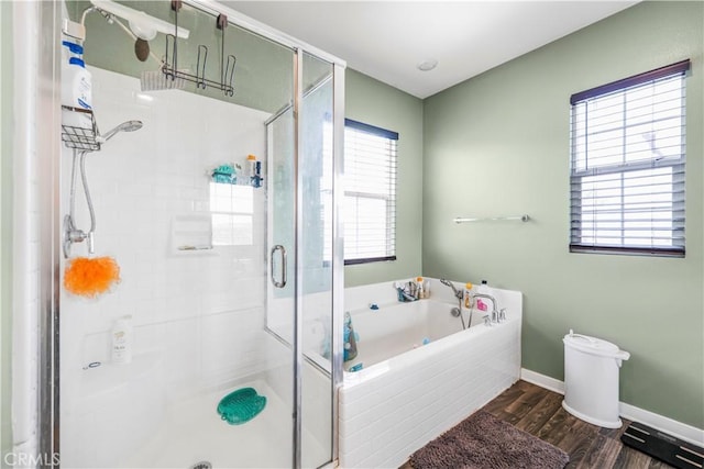 1633 Topeka Pl, Upland, CA 91784 - bathroom featuring a shower stall, a garden tub, and wood finished floors