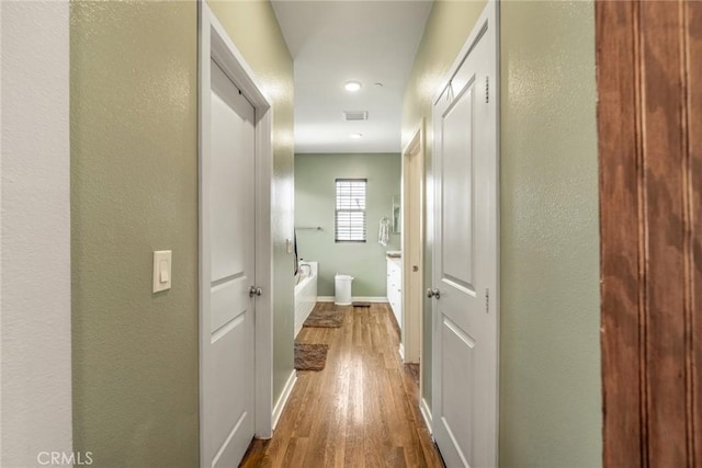 1633 Topeka Pl, Upland, CA 91784 - hall featuring dark wood finished floors, a textured wall, and recessed lighting