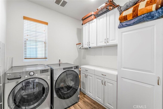 1633 Topeka Pl, Upland, CA 91784 - laundry room with washing machine and clothes dryer, cabinet space, and light wood finished floors