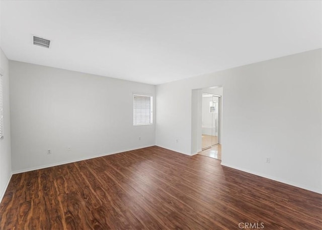 13837 Emerald Ln, Gardena, CA 90247 - spare room with wood finished floors and baseboards
