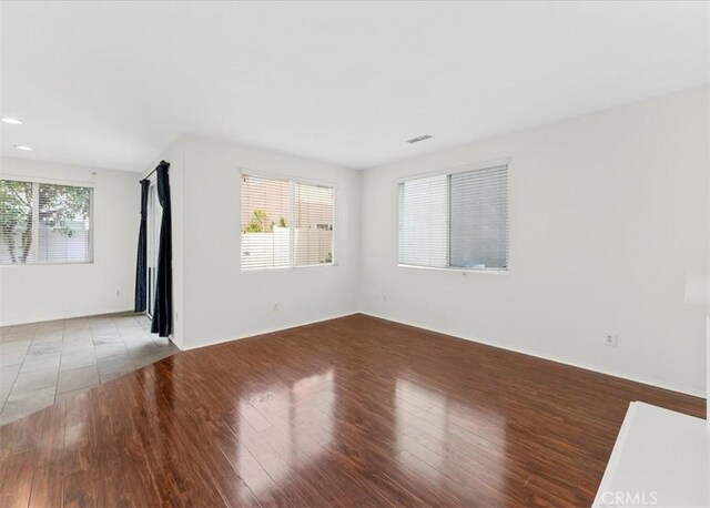 13837 Emerald Ln, Gardena, CA 90247 - spare room with wood finished floors and recessed lighting