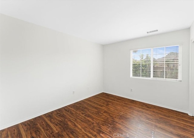 13837 Emerald Ln, Gardena, CA 90247 - unfurnished room featuring dark wood finished floors and baseboards