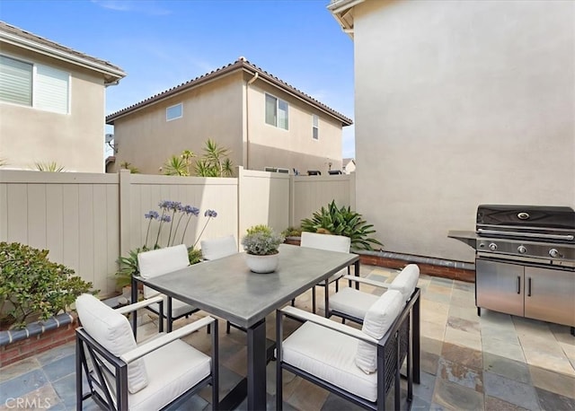 13837 Emerald Ln, Gardena, CA 90247 - fenced backyard featuring outdoor dining area, a patio, and a grill