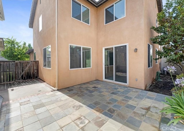 13837 Emerald Ln, Gardena, CA 90247 - rear view of house with stucco siding and a patio area