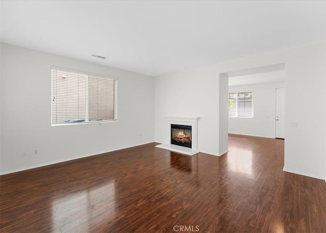 13837 Emerald Ln, Gardena, CA 90247 - unfurnished living room featuring a glass covered fireplace and wood finished floors