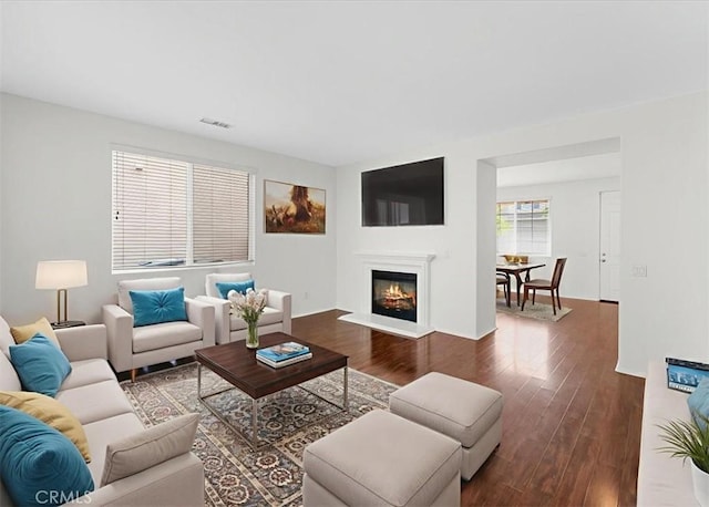 13837 Emerald Ln, Gardena, CA 90247 - living room featuring wood finished floors and a glass covered fireplace