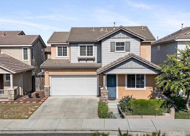 13837 Emerald Ln, Gardena, CA 90247 - traditional home with a tile roof, driveway, an attached garage, stucco siding, and stone siding