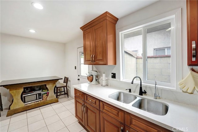 137 N Viceroy Ave, Azusa, CA 91702 - kitchen with light countertops, brown cabinetry, plenty of natural light, and recessed lighting