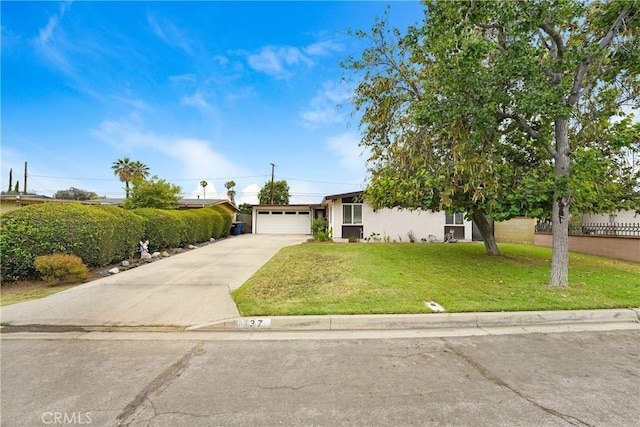 137 N Viceroy Ave, Azusa, CA 91702 - view of front of property featuring driveway, a garage, and stucco siding